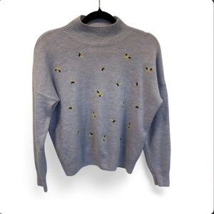 Light blue mock neck cottagecore sweater with yellow flower embroidery